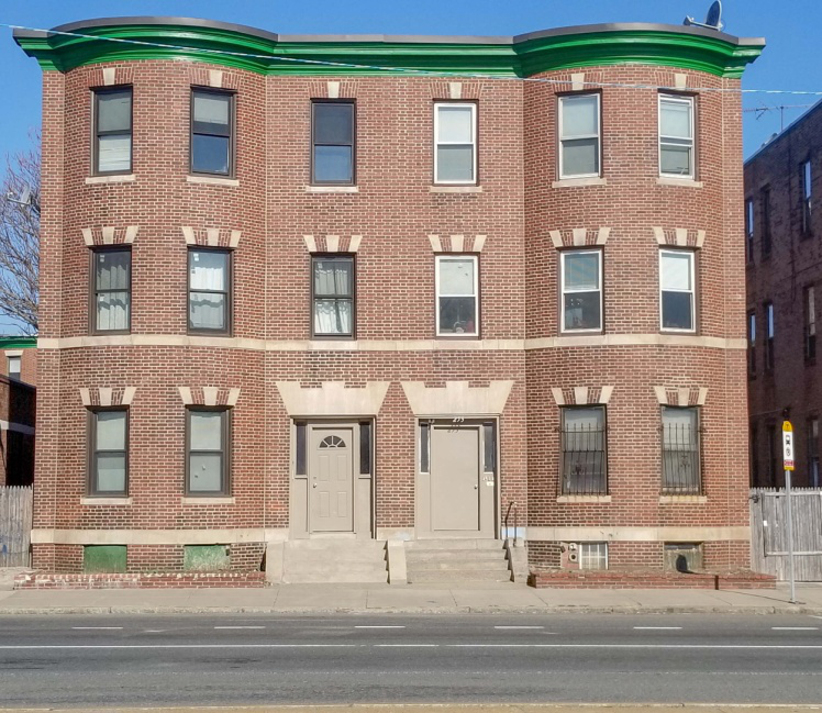 A beautifully restored commercial building in Boston, showcasing restored brickwork and a renovated facade.