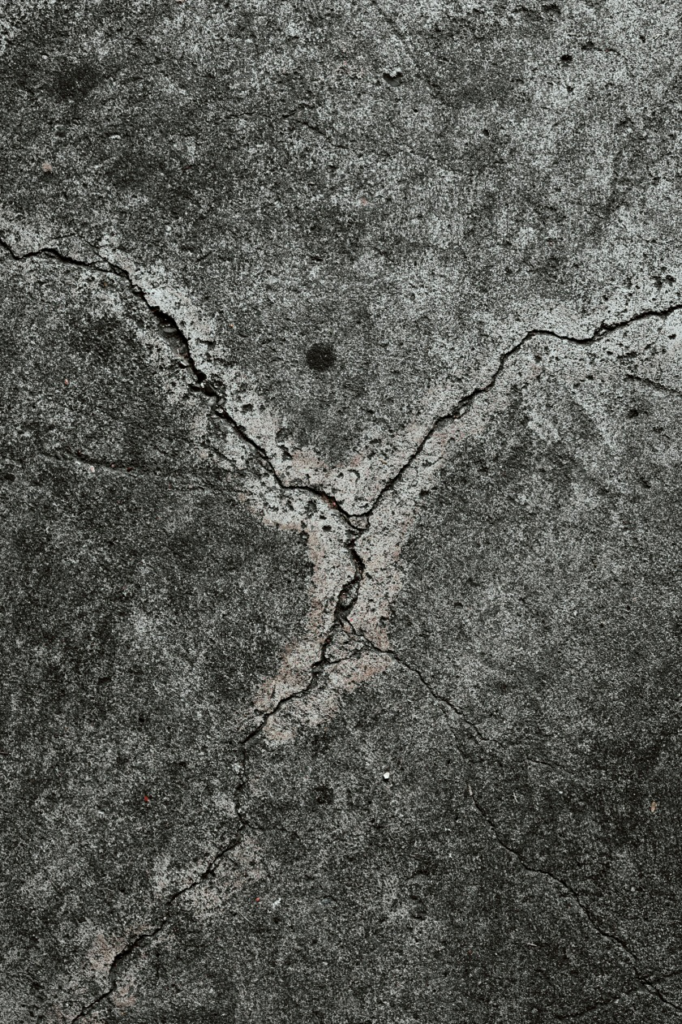 a concrete wall with cracks