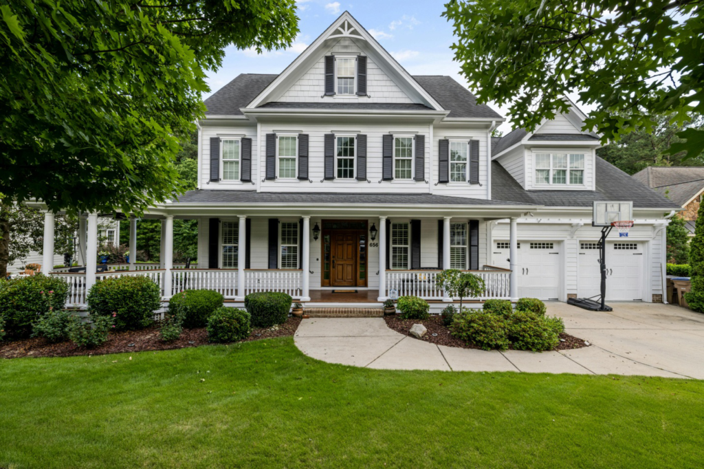 a gray and white house with a curved walkway