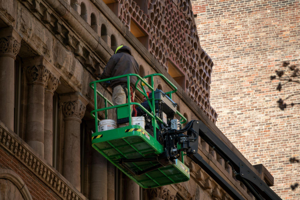 A man doing restoration work on an old building