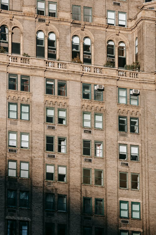 Historic high-rise with stone detailing and arched windows