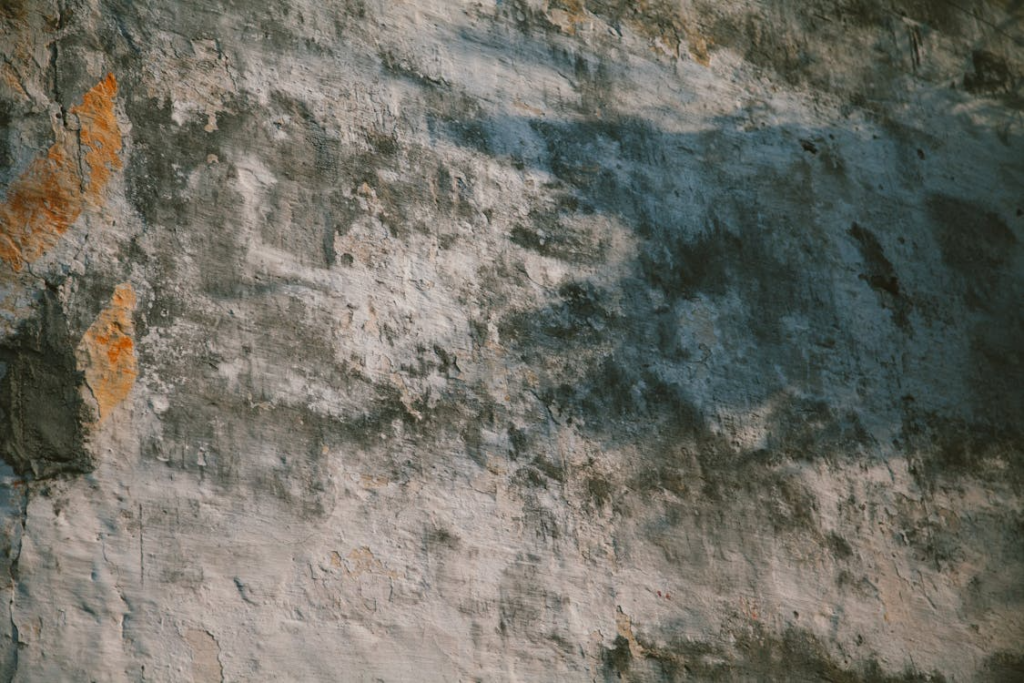 Shabby concrete wall with visible cracks