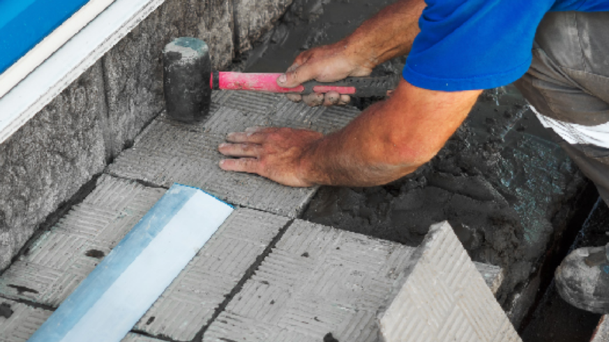 Lintel replacement services Boston installing new stone lintel with temporary shoring on commercial building
