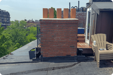 Aging masonry structure showing signs of stone lintel wear, cracking, and weather-related deterioration.