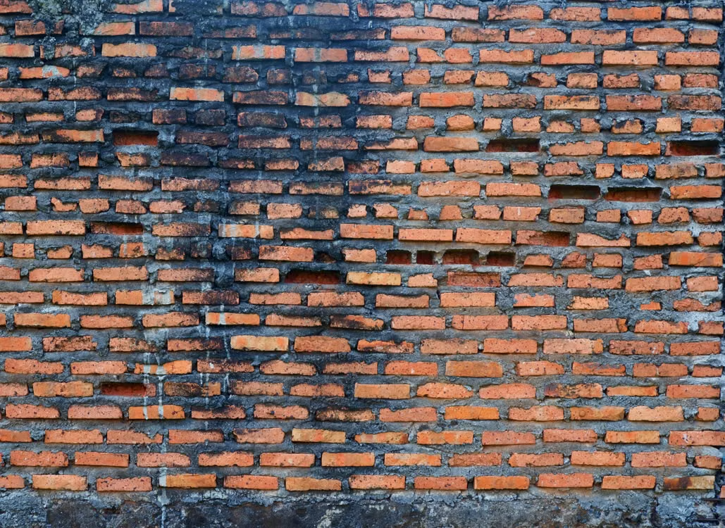 a weathered brick wall